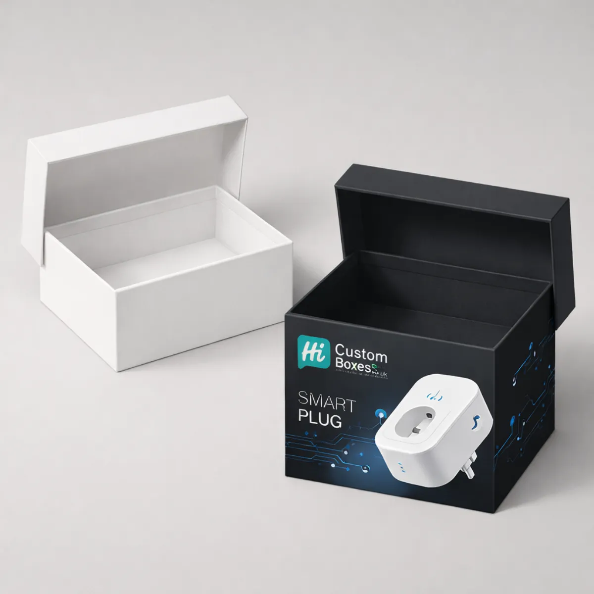 Two premium rigid gift boxes with open lids, showing a plain white box and a black branded box. class=